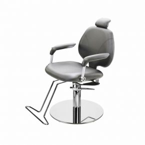 Rotating make-up chair with a chrome frame.